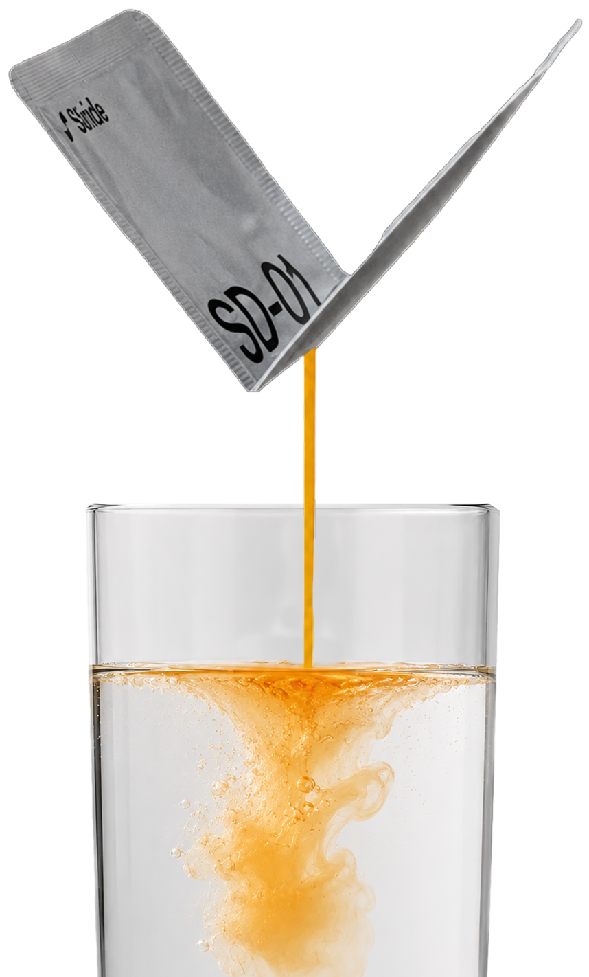 Stride SD-01 liposomal multivitamin sachet pouring into a glass of water