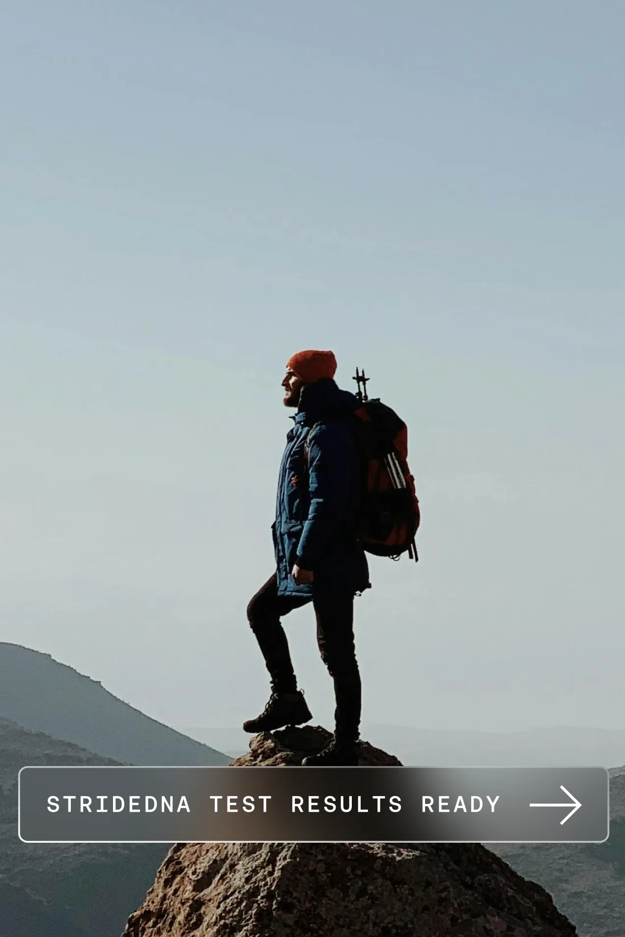 A hiker on a summit, with a notification that StrideDNA test results are ready